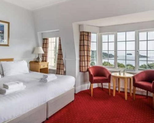 A Headland bedroom with sea-view windows