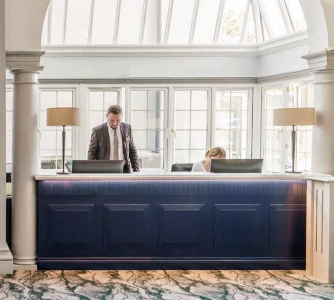 The Headland Hotel reception desk beneath the glass dome